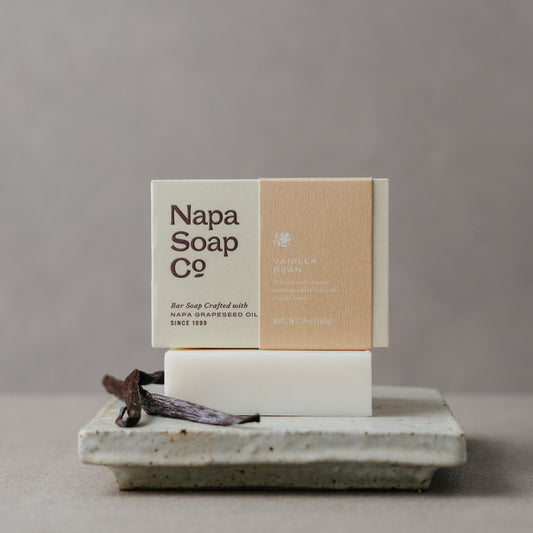 Napa Soap Co. bar soap with packaging on a stone surface