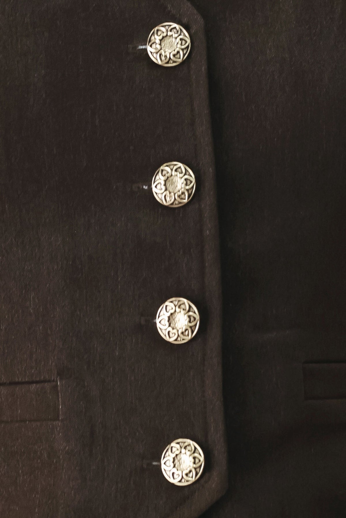 Fabric swatch showing the brown polyester-viscose-spandex suiting weave.