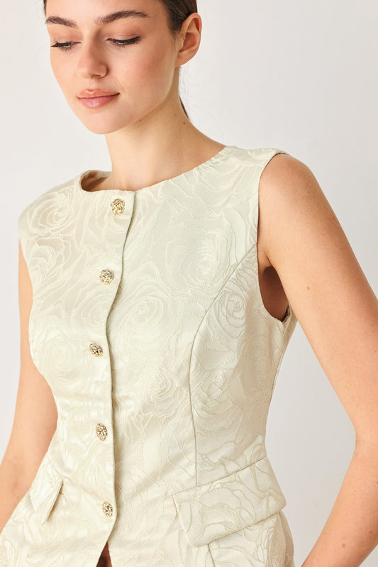Sleeveless jacquard vest with a round neckline and front button-down closure.