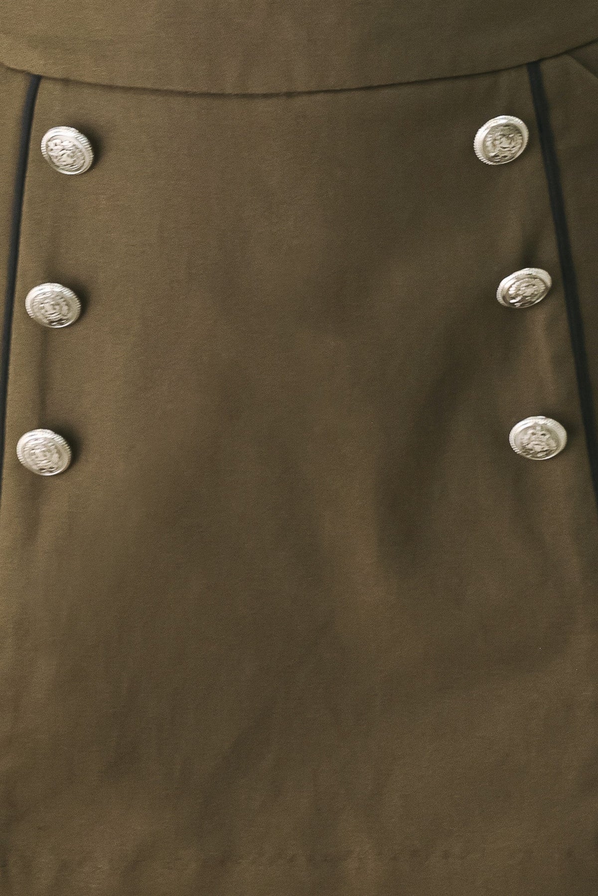 Fabric swatch showing the 100% cotton olive woven fabric of the Ranger Green skort.