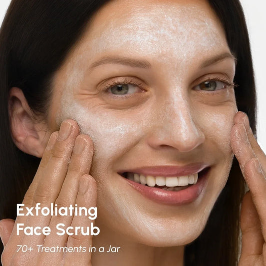 Woman applying exfoliating face scrub to her face with text overlay.