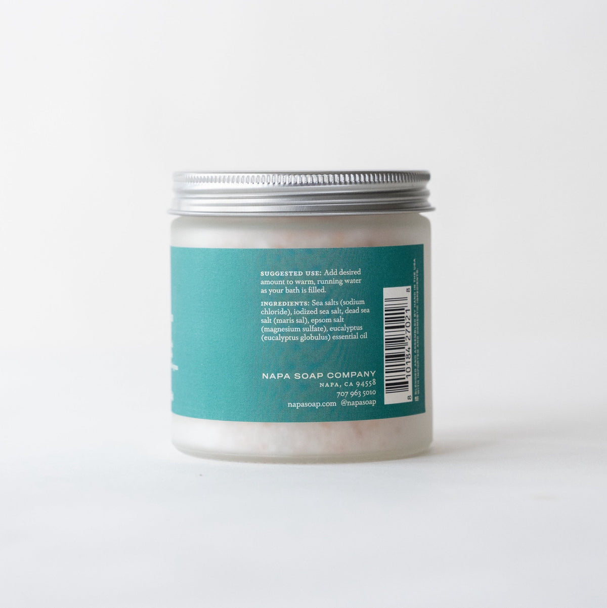 Eucalyptus Spa bath salt soak jar with a teal label and silver lid on a white background