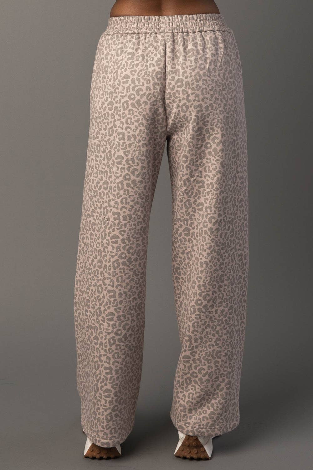 Leopard print pants on a gray background