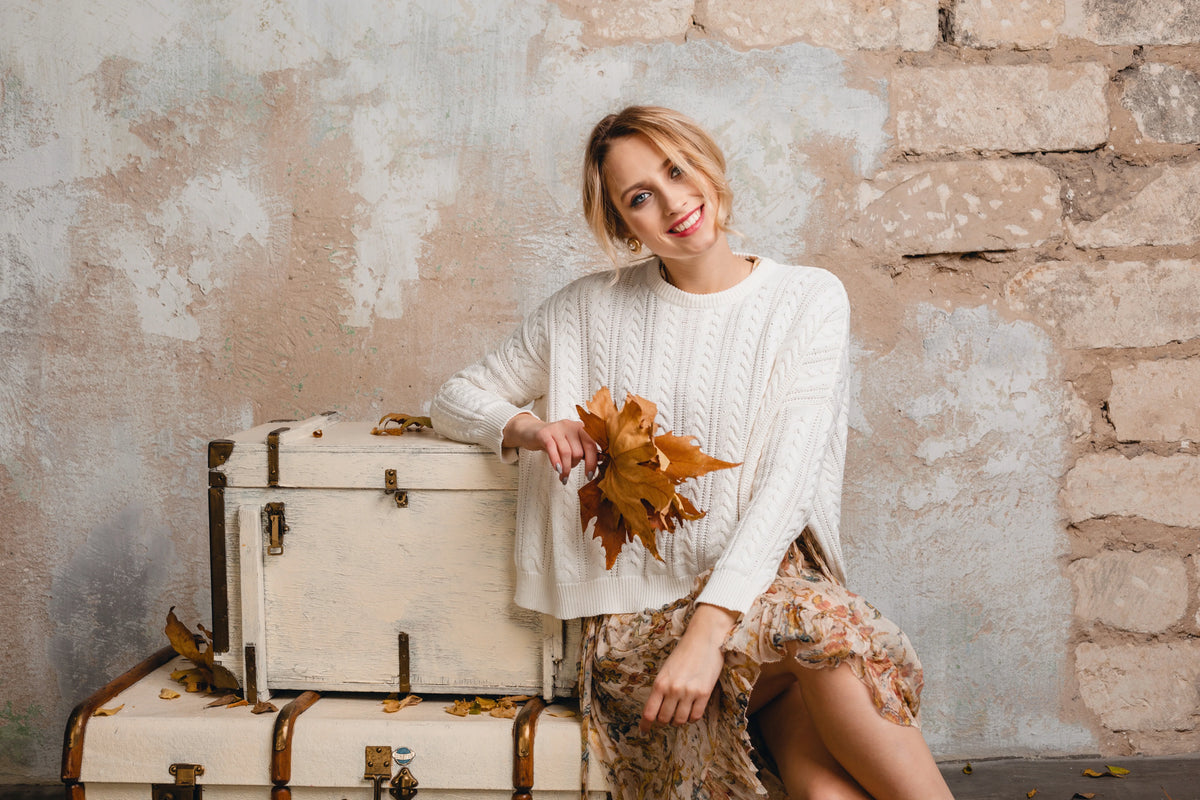 A women next to some luggages.
