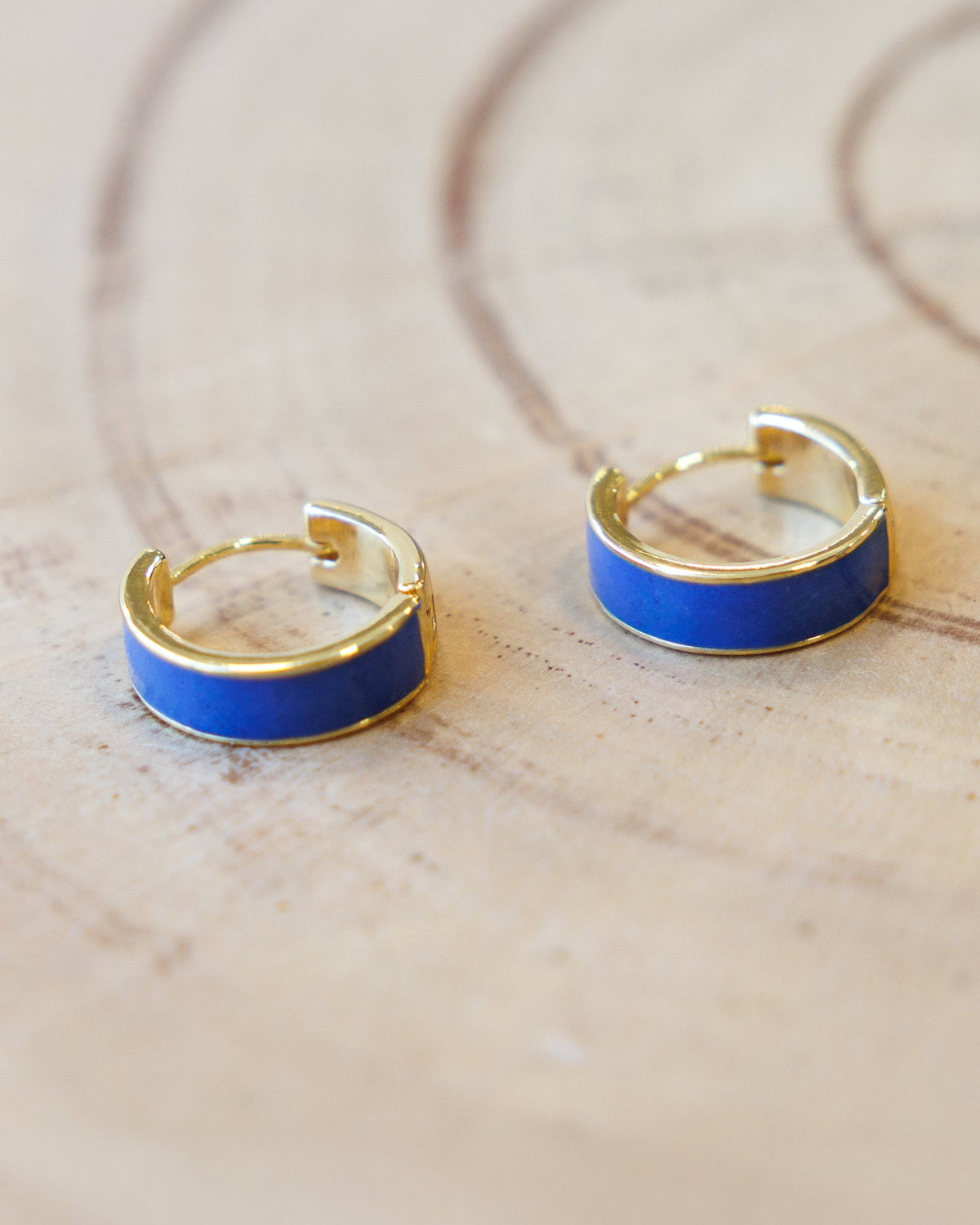 Downeast Blue Moon Huggie Hoops in gold, product photo