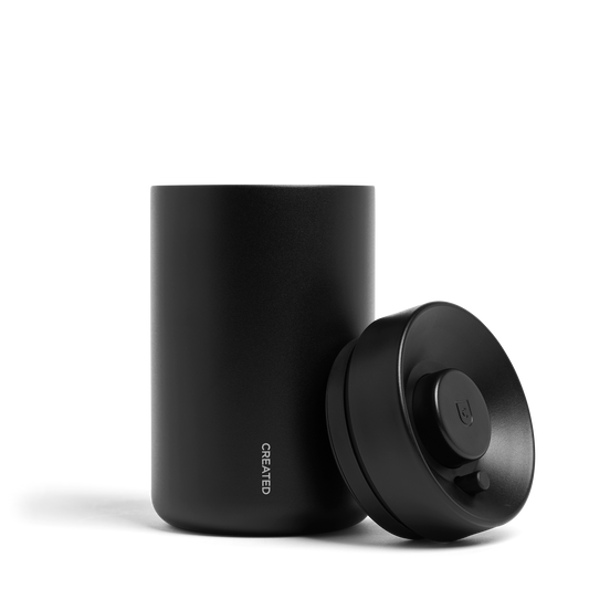 Reserve Vacuum-Seal Coffee Canister in black, lid on, against a white background