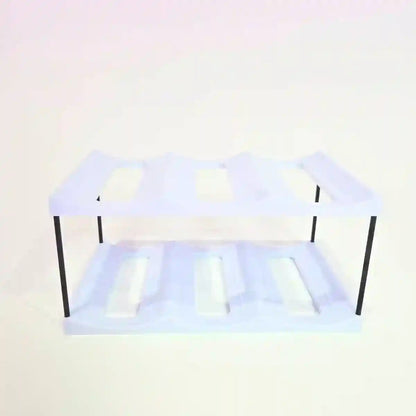 Clear plastic shelf with black metal legs on a white background
