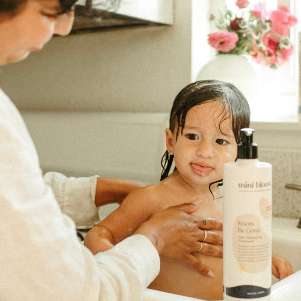 mini bloom Knots Be Gone kids hair detangling conditioner, styled photo