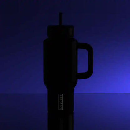 Black insulated bottle with handle on a reflective surface and dark blue background