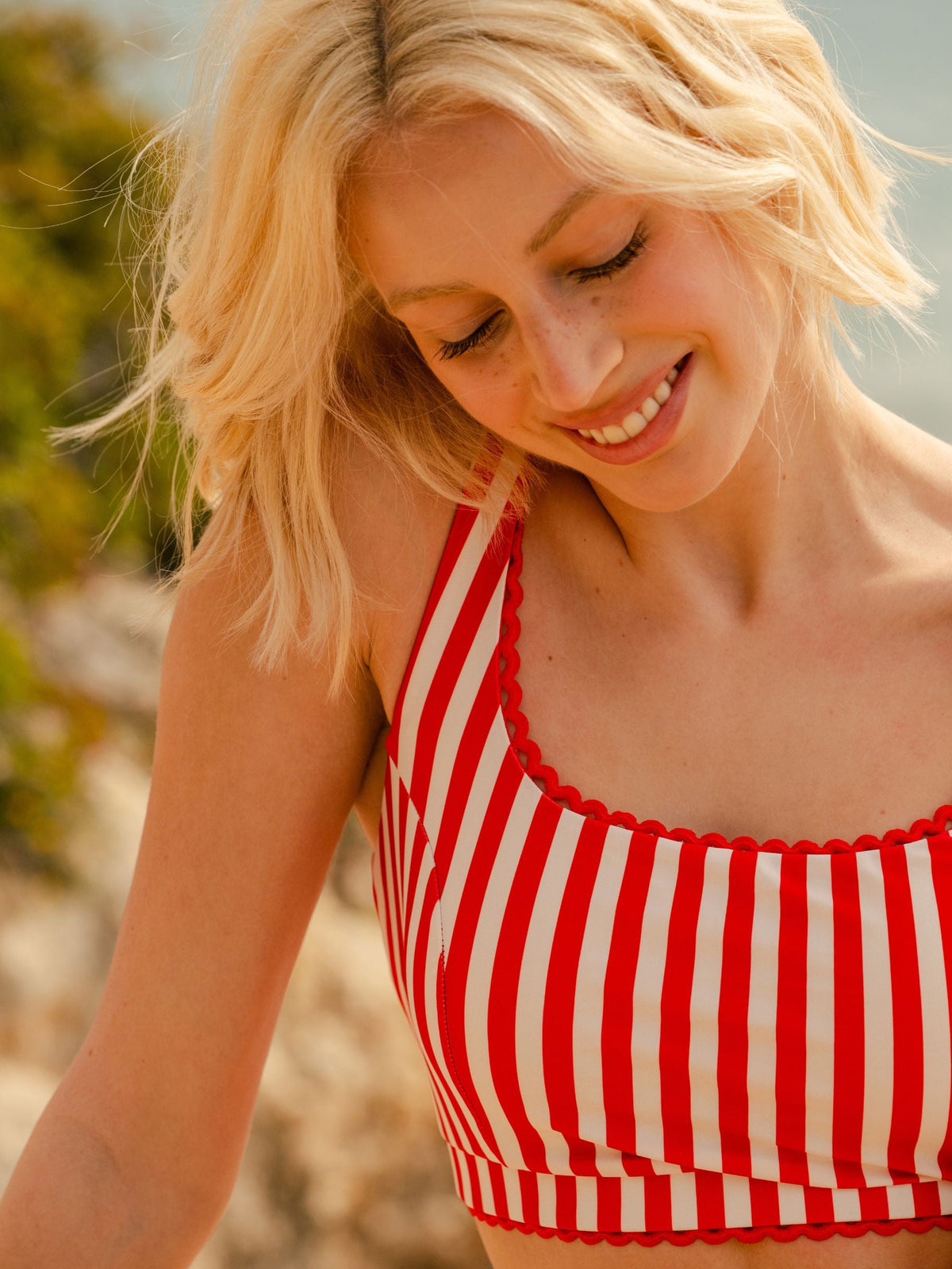 Woman wearing a red and white striped top outdoors