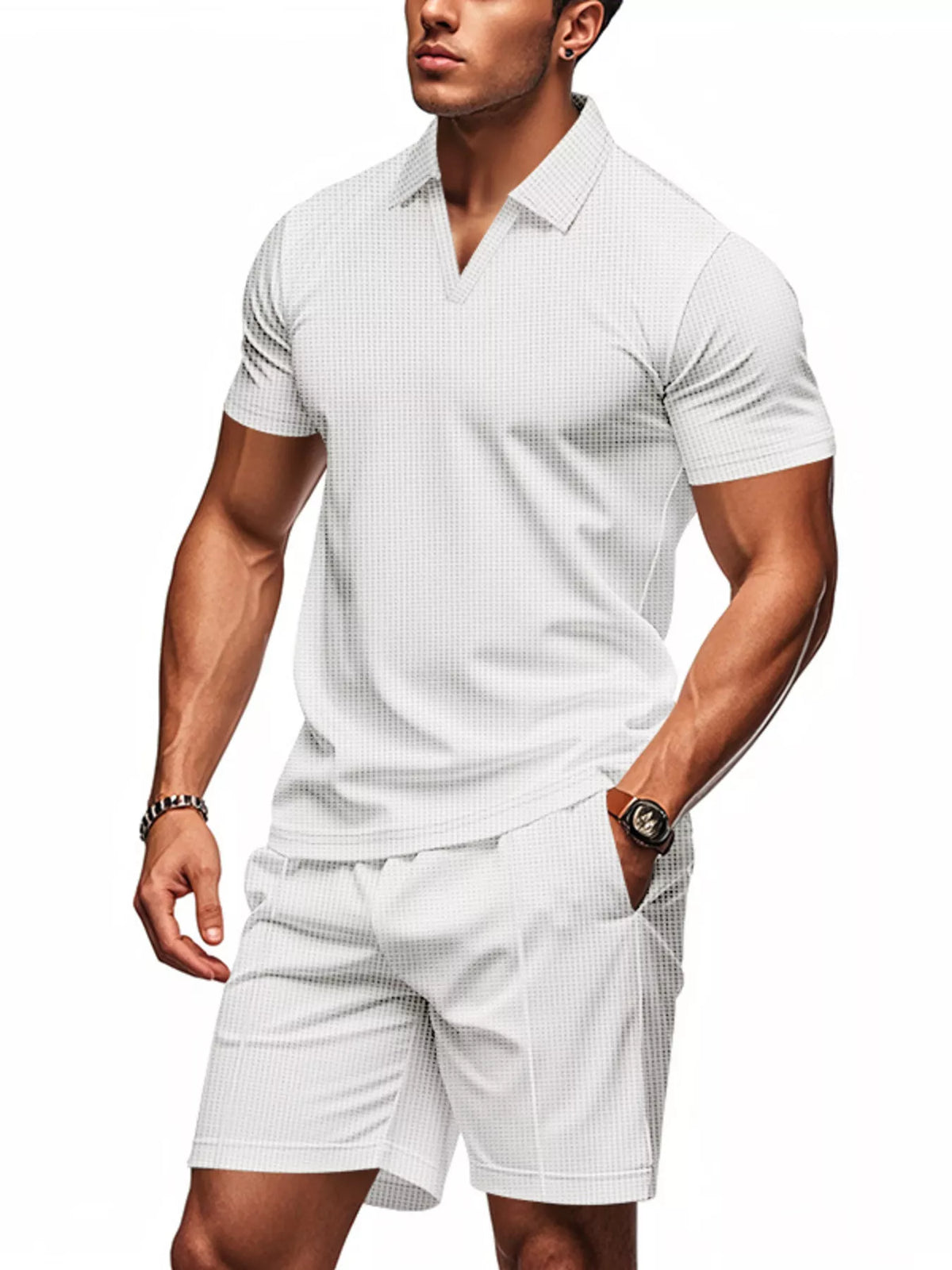 A man modeling a white short-sleeve polo shirt and matching white shorts with a subtle grid pattern, set against a plain white background.