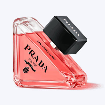 Prada perfume bottle with red liquid on a white background