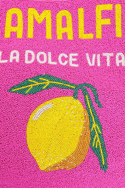 Text 'AMALFI LA DOLCE VITA' with a lemon graphic on a pink background