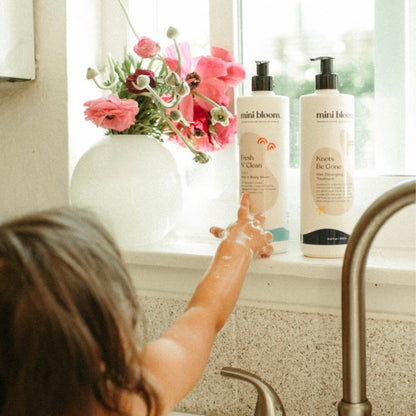 mini bloom Bath Time Duo wash and detangler set, styled photo
