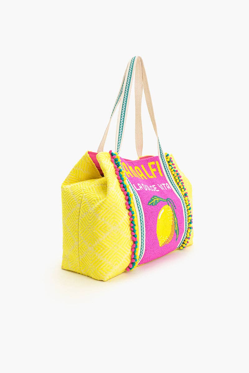 Colorful tote bag with pink top section and yellow body on a white background