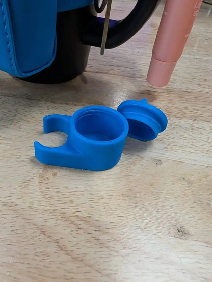 Blue silicone cup holder on a wooden surface