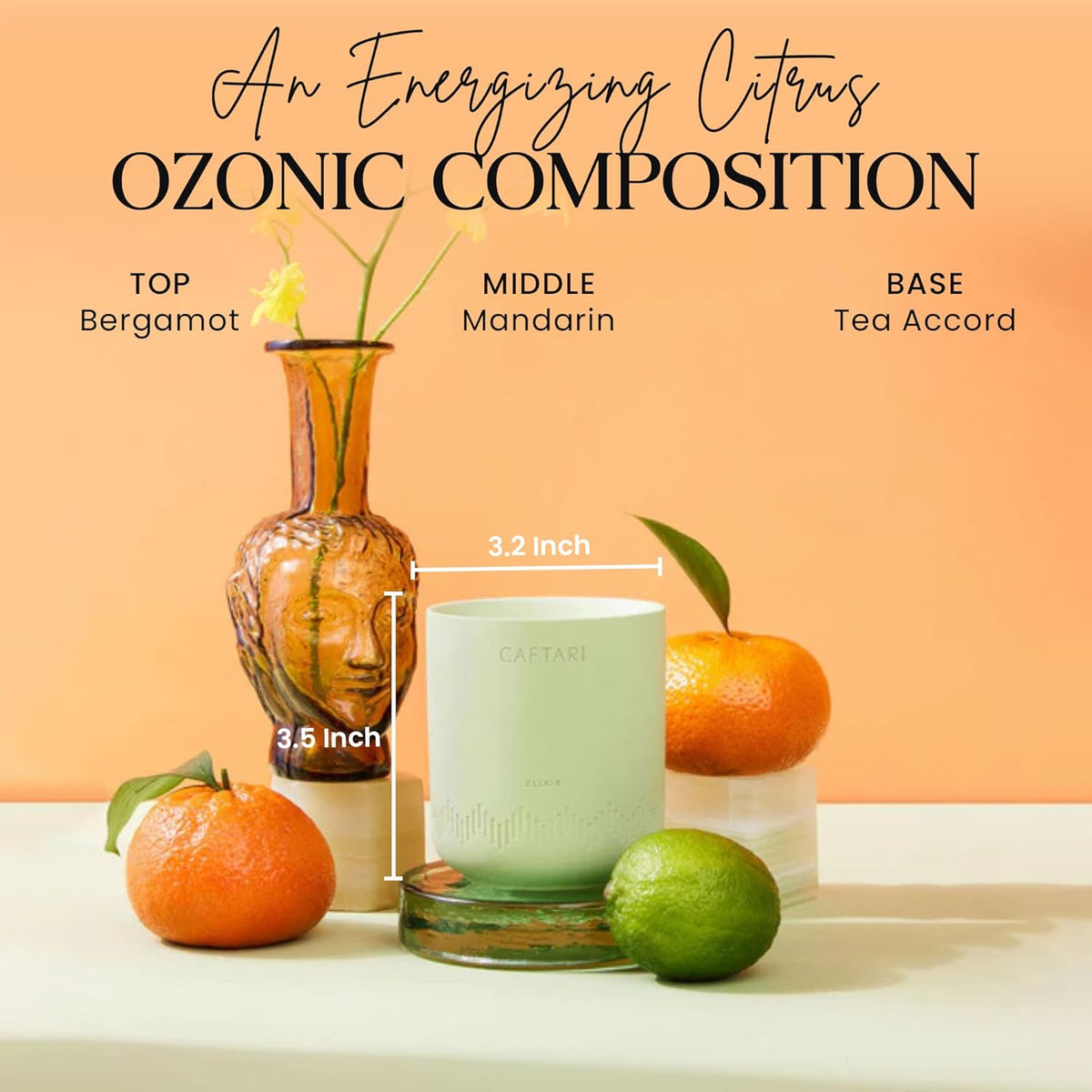 Elixir Bergamot Scented Candle styled with citrus fruit and a vase on an orange background, captioned as an energizing citrus composition
