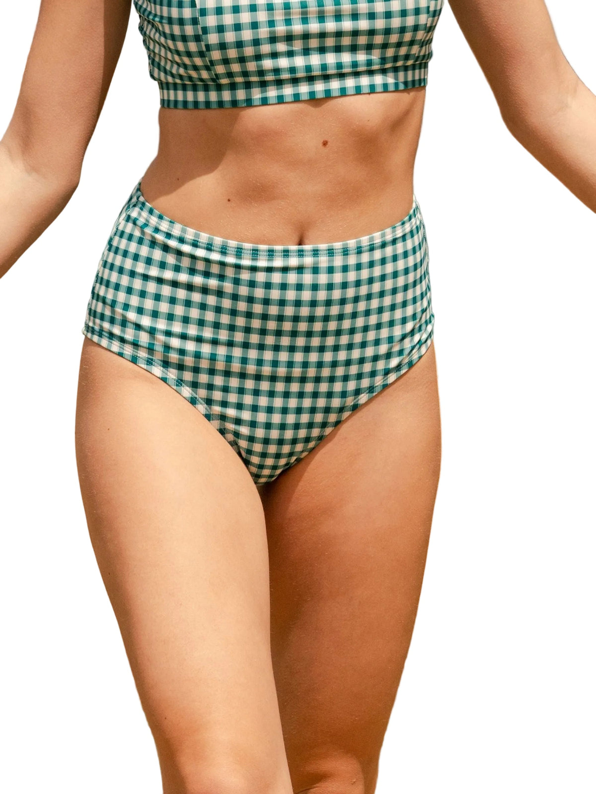 A model wearing a green and white gingham bikini set, featuring a cropped top and high-waisted bottoms, shown against a plain white background.