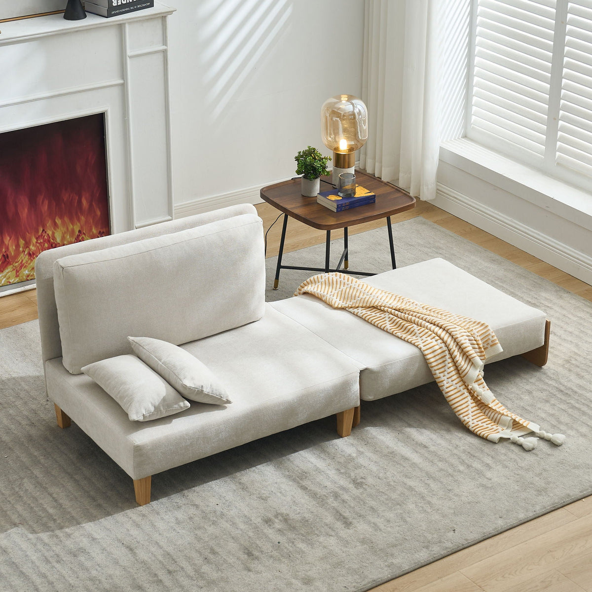 Foldable convertible sofa bed with pillows arranged on the seat (view 87)