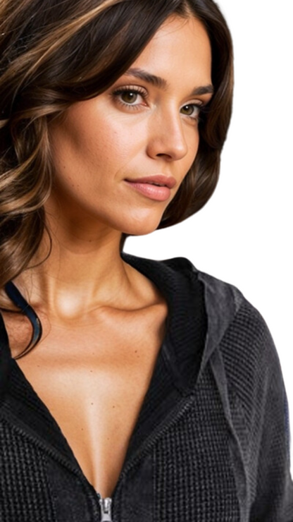 Woman wearing a black zip-up hoodie on a white background