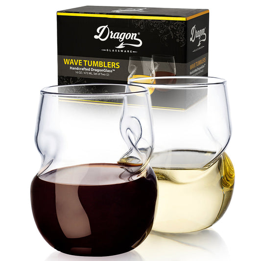 Two clear wine tumblers filled with red and white wine, with a Dragon Glassware box in the background.