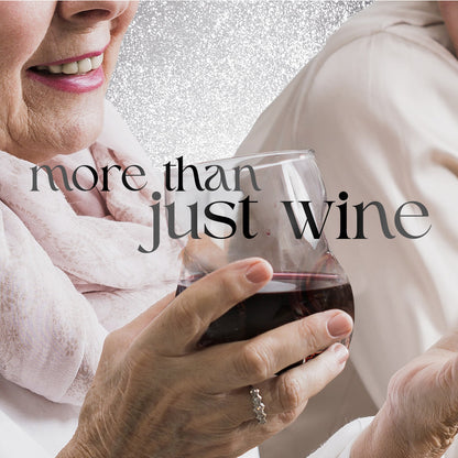 Person holding a glass of red wine with 'more than just wine' text overlay.