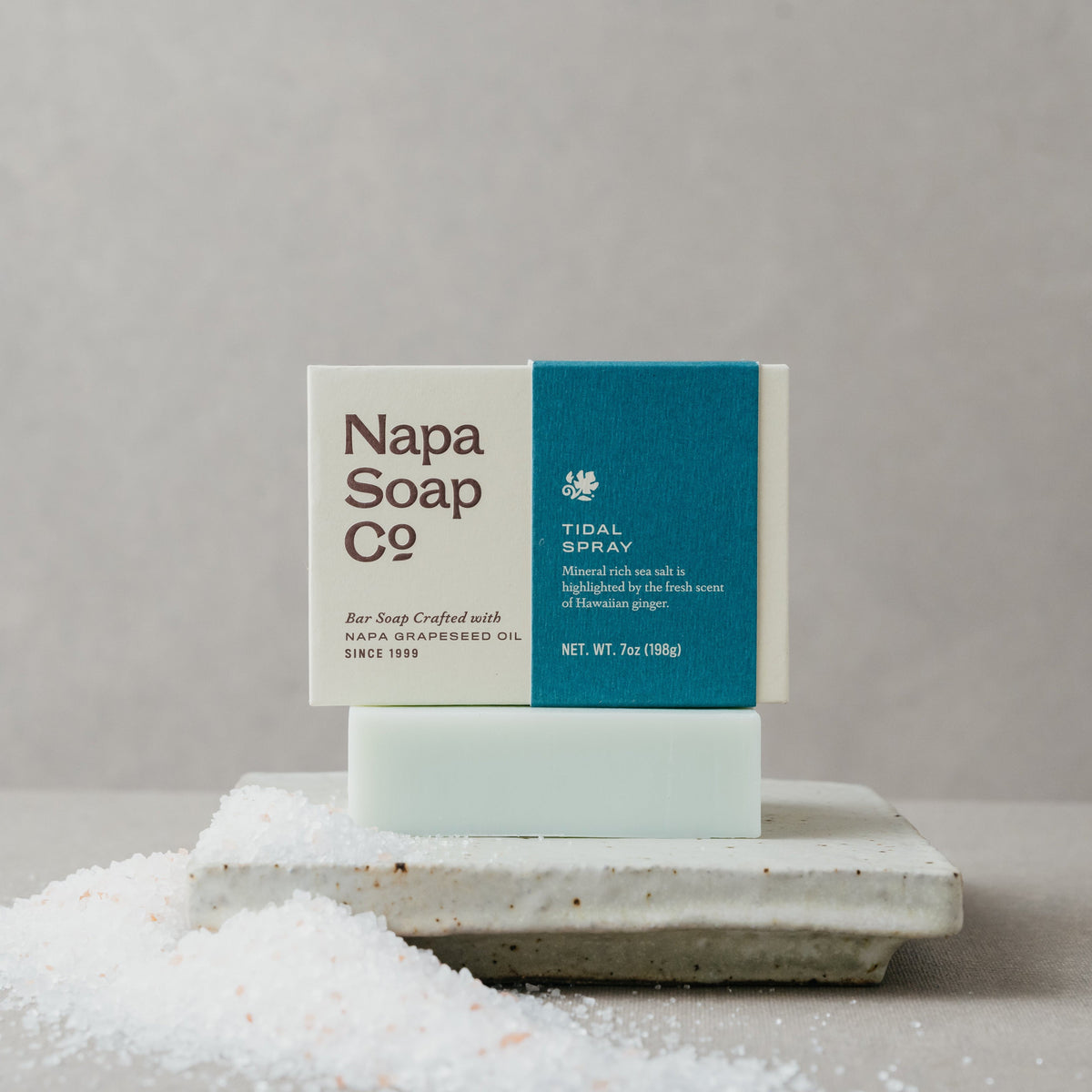 Napa Soap Co. bar soap on a stone surface with a gray background