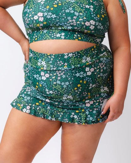 Green floral two-piece swimsuit on a white background