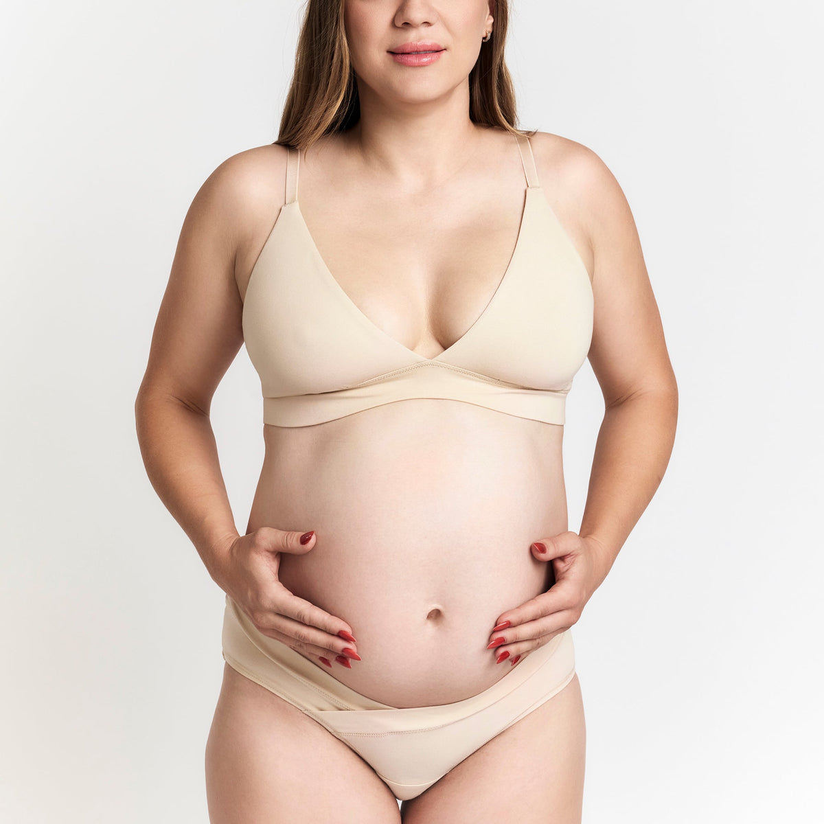 Organic Cotton Maternity Brief in Latte, on a pregnant model on a light background