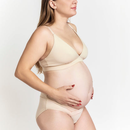 Organic Cotton Maternity Brief in Latte, on a pregnant model on a white background
