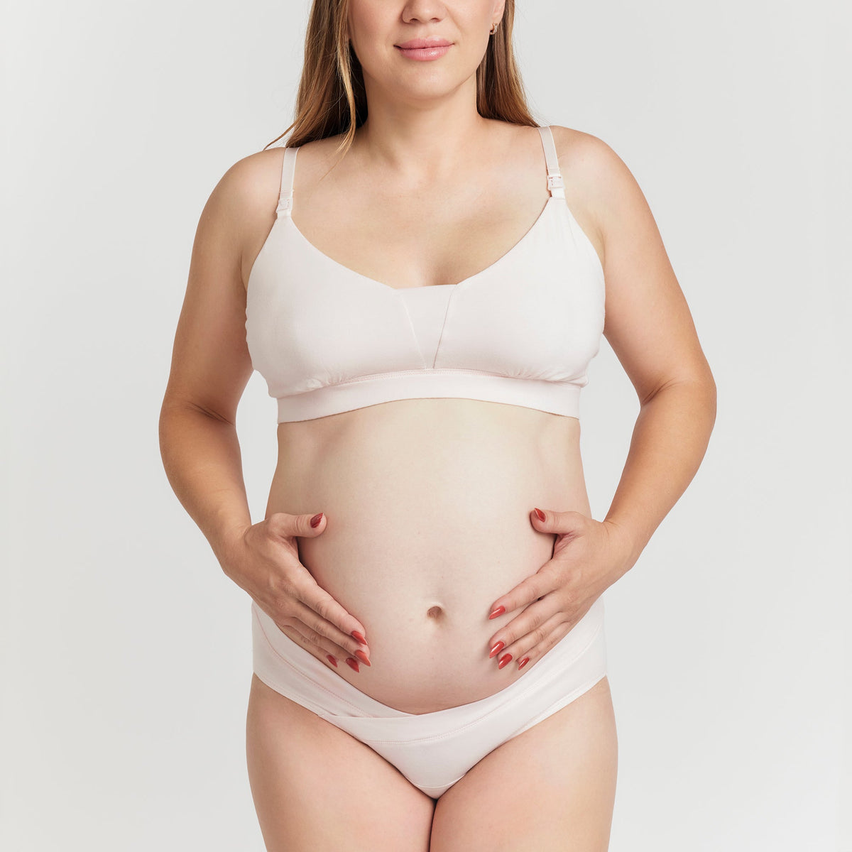 Organic Cotton Maternity Brief in Pink, on a pregnant model on a light gray background