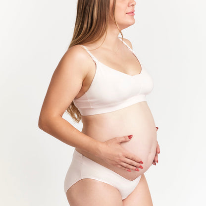 Organic Cotton Maternity Brief in Pink, worn with a tank top on a plain background