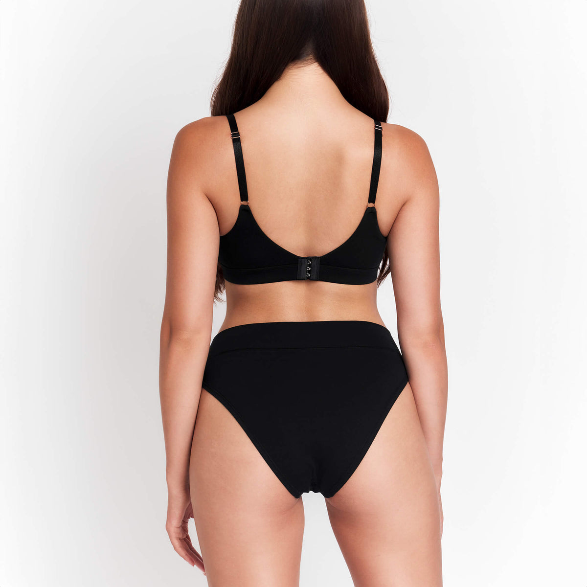 Organic Cotton Cheeky Tanga in Black, on-model view