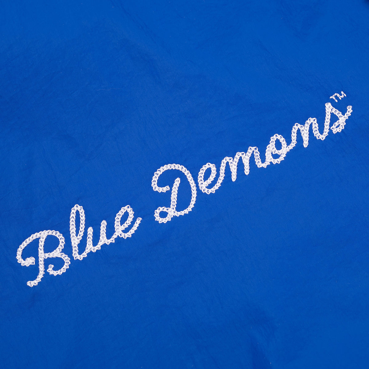 Blue shirt with 'Blue Demons' text in white on a blue background