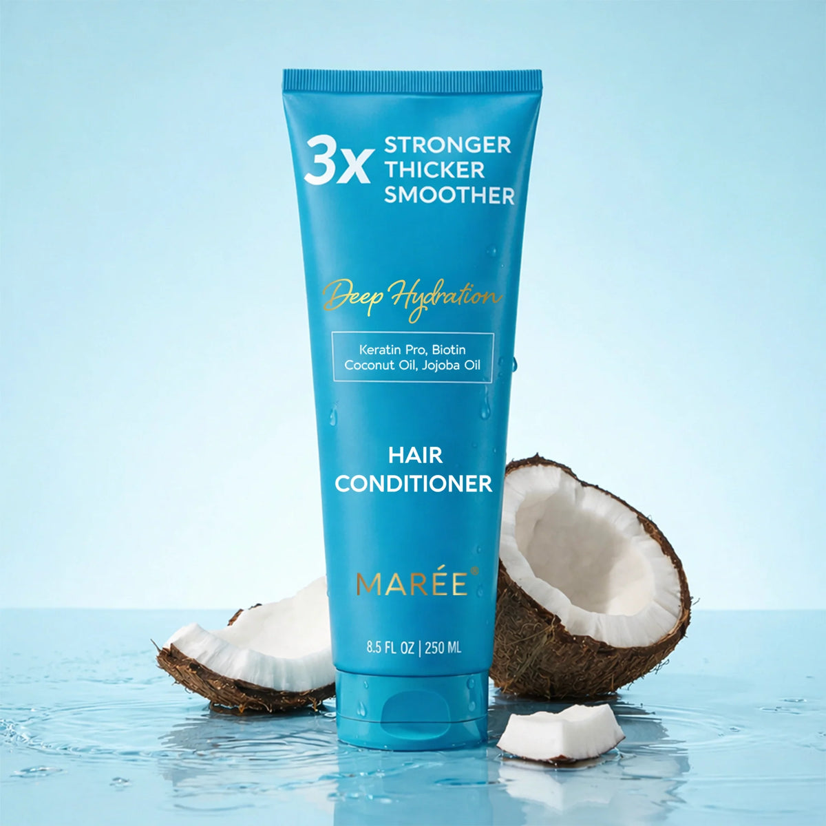 A tube of Marée Hair Conditioner stands upright on water with coconut halves around it. The tube is bright blue with white and gold text reading '3x Stronger Thicker Smoother' and 'Hair Conditioner.