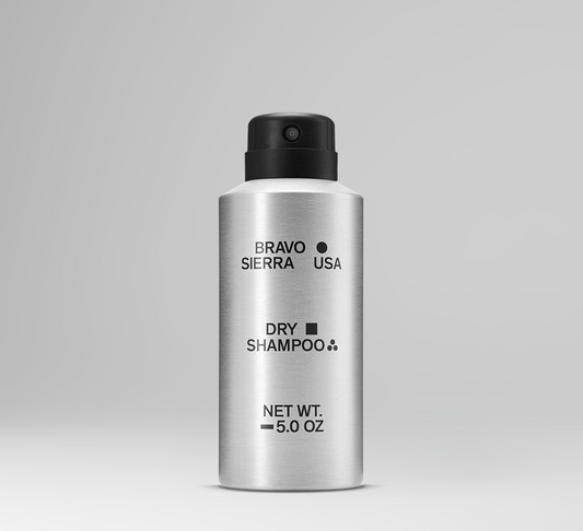 Silver bottle of Bravo Sierra USA dry shampoo on a gray background