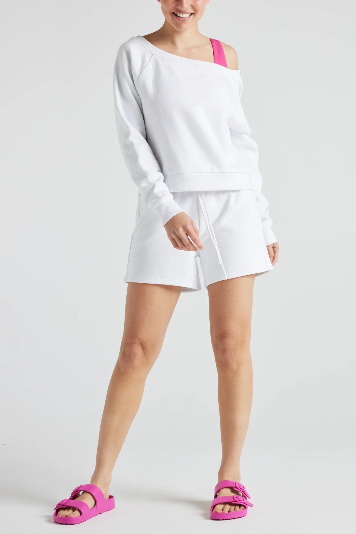 Fitkitty Culture Electric fleece shorts styled with a white off-shoulder sweatshirt