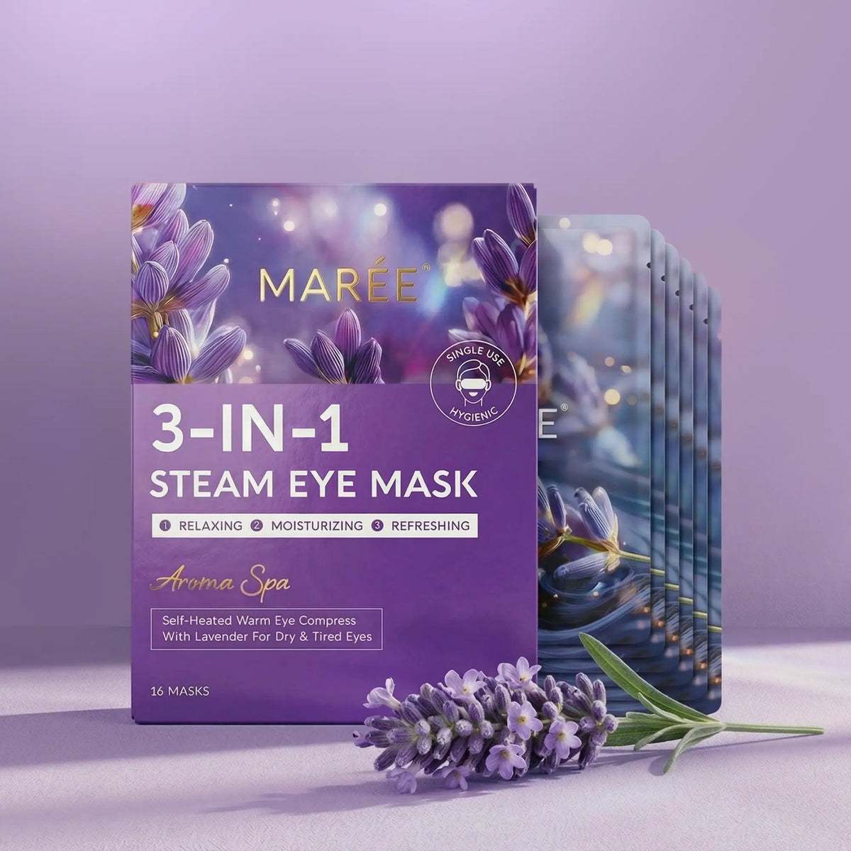 MARÉE 3-In-1 Steam Eye Mask in 'Aroma Spa' lavender scent, featuring a purple box with lavender illustrations and a fan of single-use masks in the background, styled with fresh lavender sprigs on a matching purple surface.