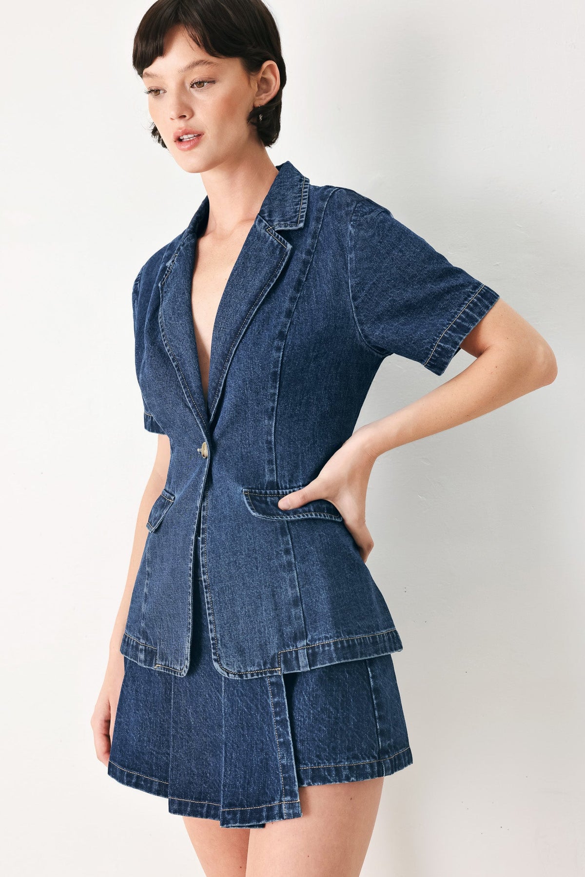 Deep V-front and collar detail on The Power Move washed denim jacket.