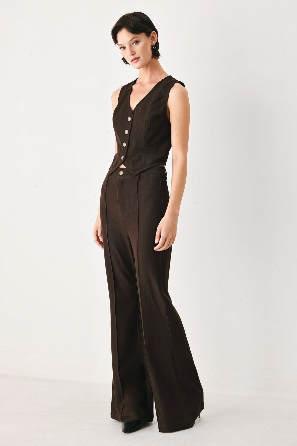 Brown suiting vest with a classic button-front design and streamlined cut.