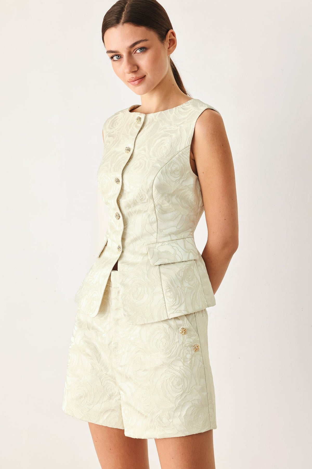 Softly textured floral jacquard fabric of the Marzipan Floral vest.