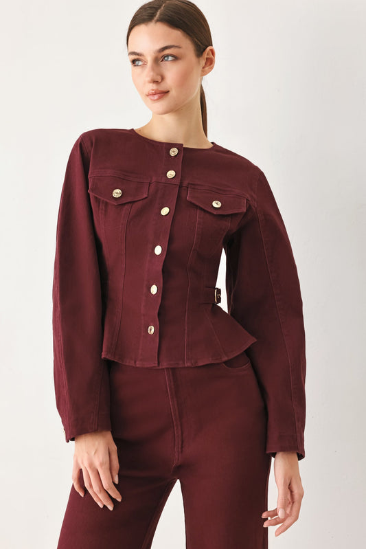 Burgundy woven jacket with a round neckline and button front, shown on a model against a plain studio background.