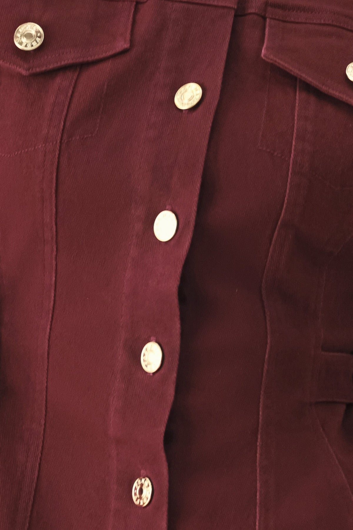 Close-up of the burgundy cotton-spandex woven fabric used for the Merlot Ridge jacket.