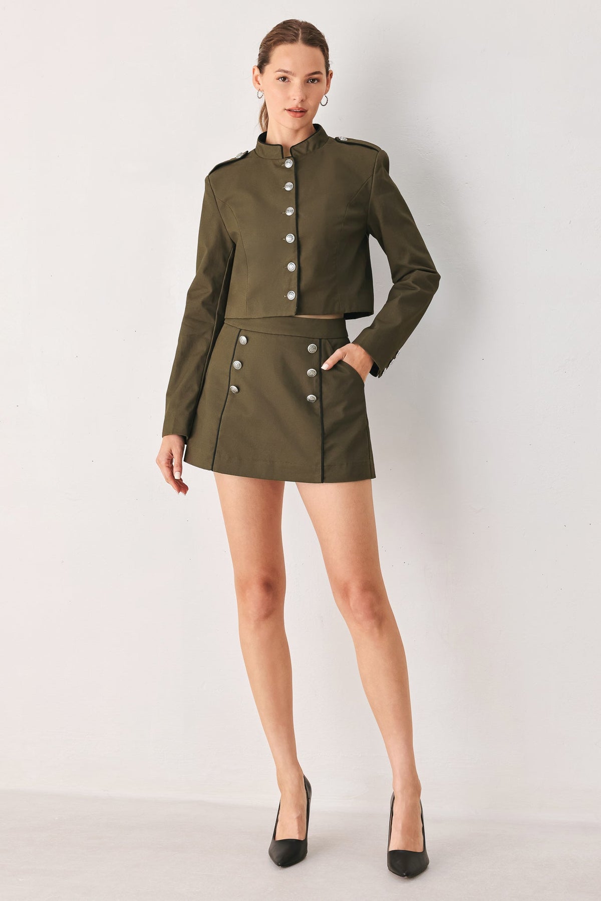 Cotton woven crop jacket in olive, cut to an approximate 17 inch cropped length.
