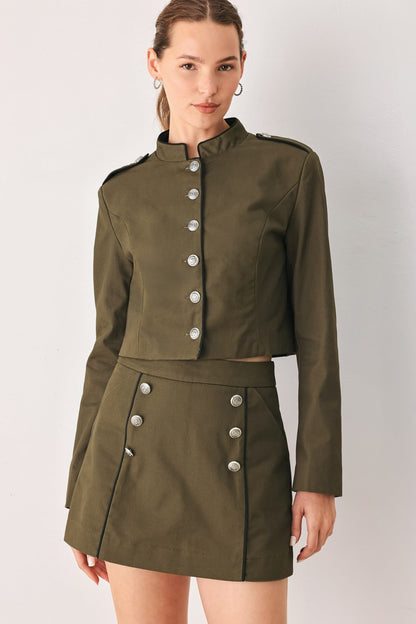Olive utility crop jacket with shoulder tabs and a front button-down closure.