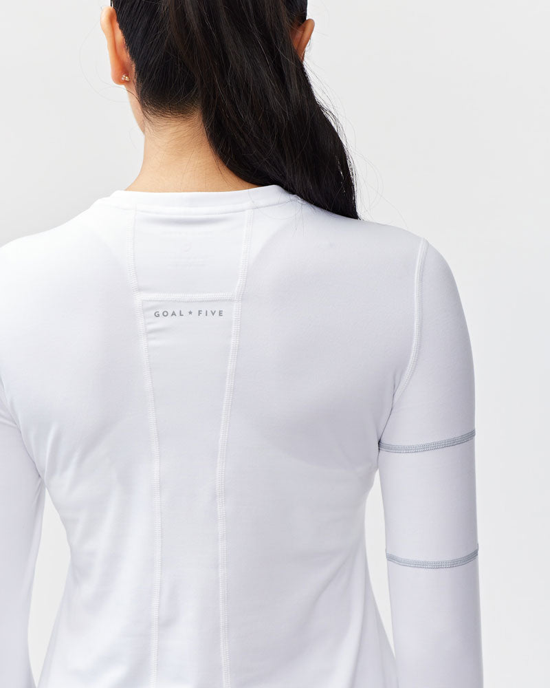 Foudy Women's Longsleeve Workout Top in White, styled photo