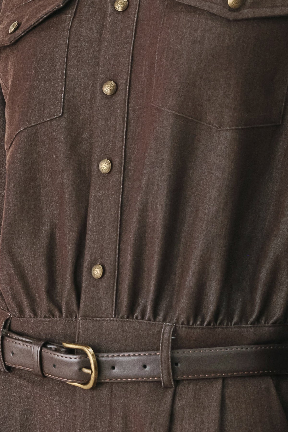 Fabric swatch showing the brown polyester-viscose-spandex woven fabric of the Rich Cocoa romper.