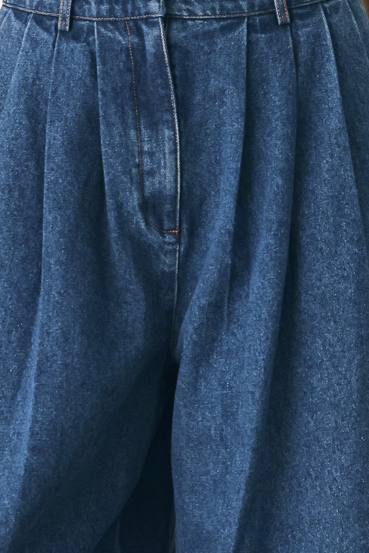 Close-up of the medium indigo cotton-blend denim fabric used for the Blue Echo wide-leg pants.