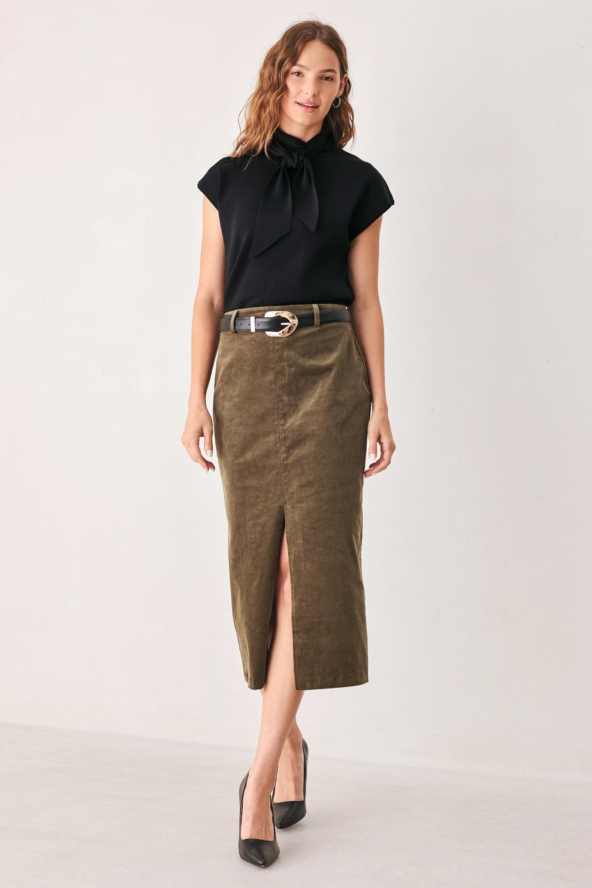 Amberglow scarf sweater top styled with tailored trousers.