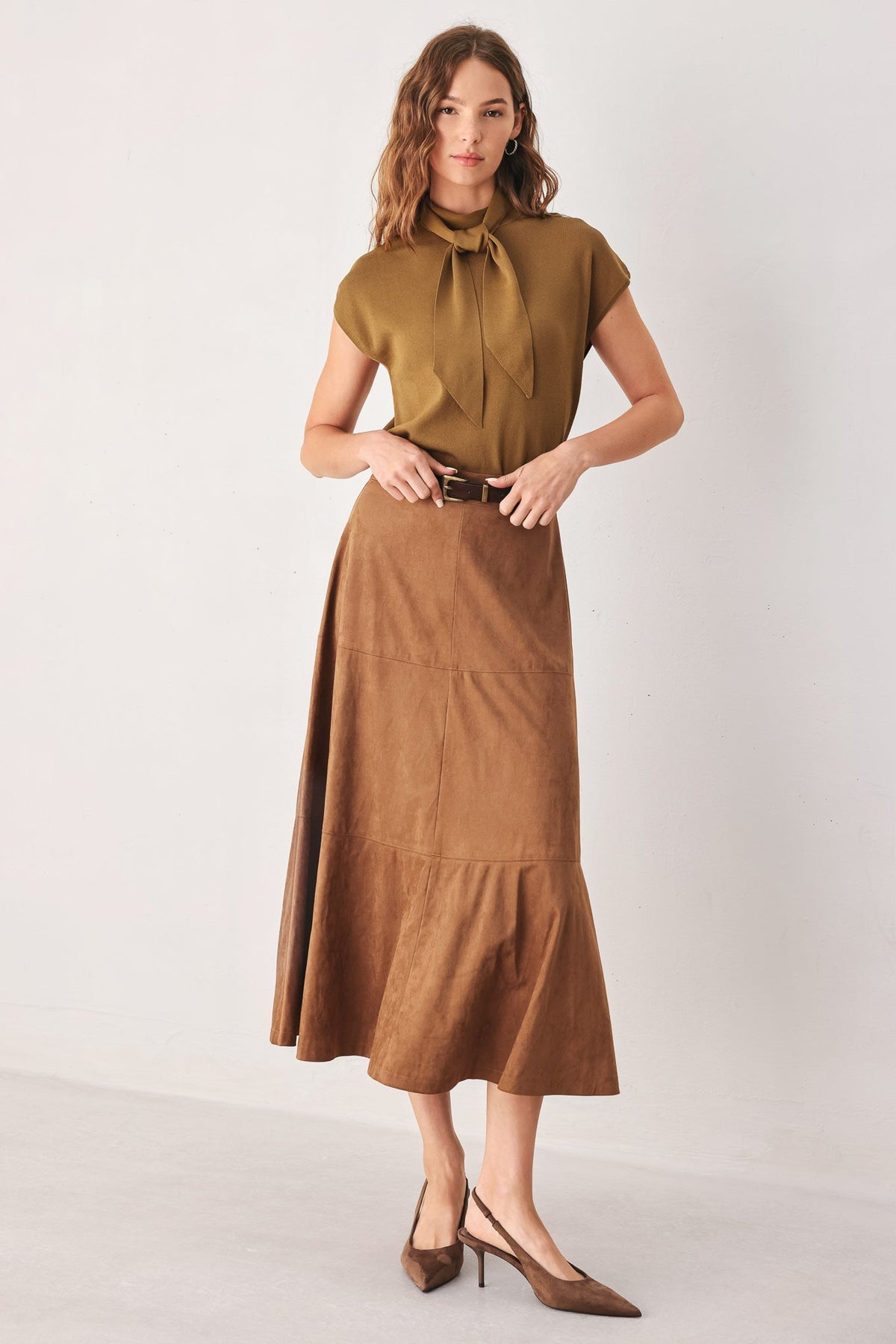 Amberglow soft knit top styled with denim for an elevated everyday look.